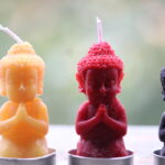 Praying buddha candle